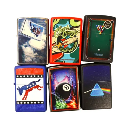Sale Photo Thumbnail #157: Collection of six Zippo windproof lighters featuring various pop culture, billiards, and music-themed graphics, including Pink Floyd's Dark Side of the Moon and Cheech & Chong.