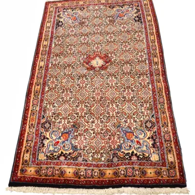 Sale Photo Thumbnail #218: Hand-knotted Persian-style area rug featuring an intricate all-over floral pattern with central medallion, corner spandrels, and multi-tiered borders in shades of red, navy blue, and cream.