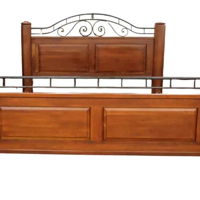 Sale Photo Thumbnail #32: Lexington Bob Mackie Rustic wooden bed frame featuring raised panel details and decorative wrought iron scrollwork accents on the headboard and footboard.