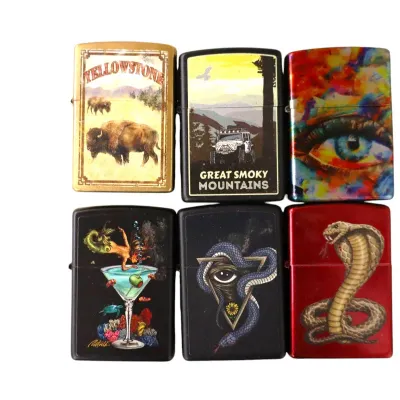 Sale Photo Thumbnail #155: Collection of six Zippo-style windproof lighters featuring various graphic designs, including national parks, a cobra, and abstract art.