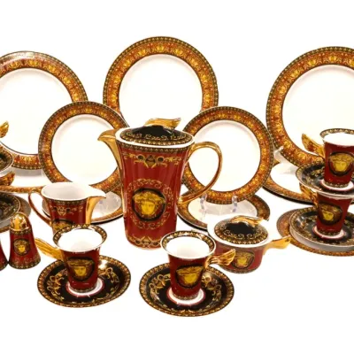 Sale Photo Thumbnail #8: Rosenthal for Versace 'Les Trésors de la Mer' or Medusa-style porcelain dinnerware and coffee service, featuring rich red ground with gold baroque scrolls, Medusa crests, and gilded handles.