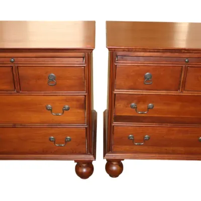 Sale Photo Thumbnail #31: Lexington Bob Mackie Pair of traditional cherry wood nightstands featuring pull-out tray slides, brass drop-handle hardware, and large bun feet.