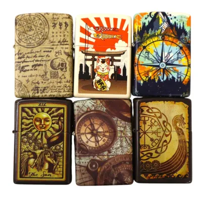 Sale Photo Thumbnail #181: Collection of six Zippo-style lighters with artistic printed graphics including tarot, Japanese folklore, navigation compass, and occult themes.