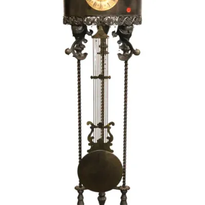 Sale Photo Thumbnail #229: Ornate antique brass and wrought iron tall floor clock featuring an exposed pendulum, decorative finials, and a gold-tone Roman numeral dial.