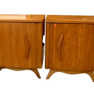Sale Photo Thumbnail #34: Pair of mid-century modern boomerang walnut wooden nightstands featuring carved chevron door handles and splayed legs.