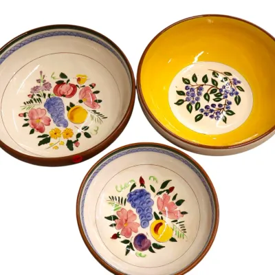 Sale Photo Thumbnail #283: Set of three hand-painted ceramic serving bowls with hand-decorated floral and fruit motifs, including a vibrant yellow-rimmed bowl.