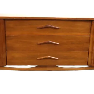 Sale Photo Thumbnail #33: Mid-century boomerang walnut modern wooden credenza with three central drawers featuring sculpted wooden pulls flanked by side cabinet doors.