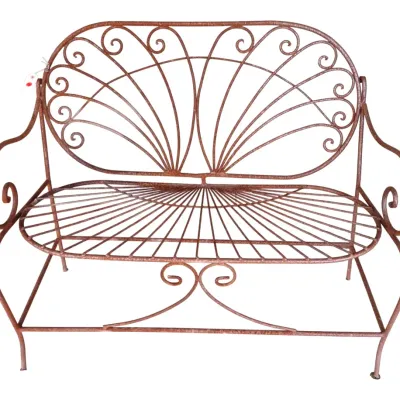 Sale Photo Thumbnail #259: Vintage rusted wrought iron garden bench featuring a fan-back scrollwork design and curved armrests.