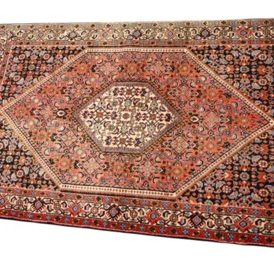 Sale Photo Thumbnail #219: Hand-knotted Persian style area rug featuring a central diamond medallion, intricate floral motifs, and a multi-tiered border in red, navy, and cream tones.