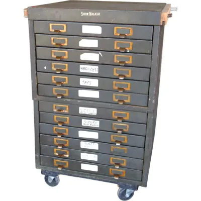 Sale Photo Thumbnail #243: Vintage Shaw-Walker industrial steel multi-drawer file cabinet on casters, featuring brass hardware and handwritten labels.