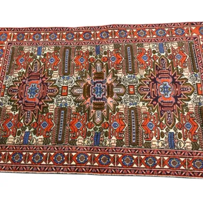 Sale Photo Thumbnail #217: Traditional Caucasian or Persian tribal area rug featuring three central medallion stars, intricate geometric motifs, and fringe along the sides.
