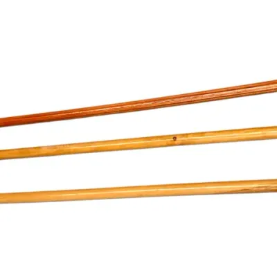 Sale Photo Thumbnail #296: Set of three vintage wooden walking canes with rubber tips and varied handles, including one with metallic accents.