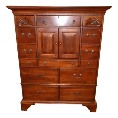 Sale Photo Thumbnail #30: Lexington Bob Mackie Colonial revival cherry chest on chest featuring carved fan motifs, brass hardware, and a center cabinet door section.