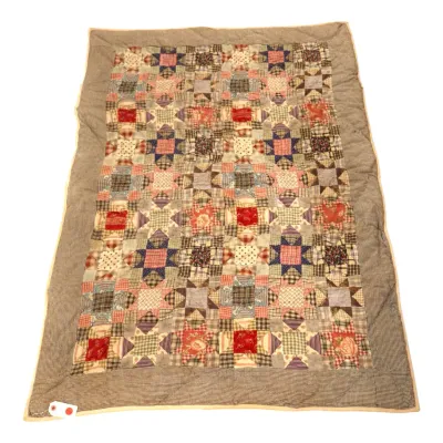 Sale Photo Thumbnail #81: Handmade patchwork star quilt featuring an array of multicolored calico, plaid, and floral fabrics with a neutral houndstooth border.