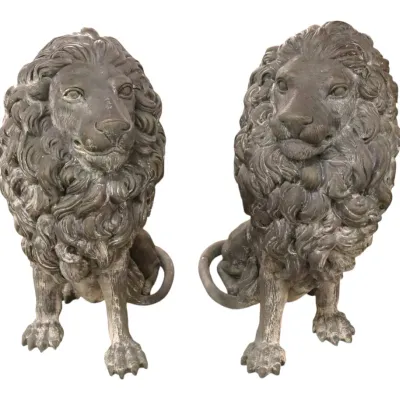 Sale Photo Thumbnail #45: Pair of 20thC vintage cast stone lion statues with detailed manes and a weathered dark patina finish.