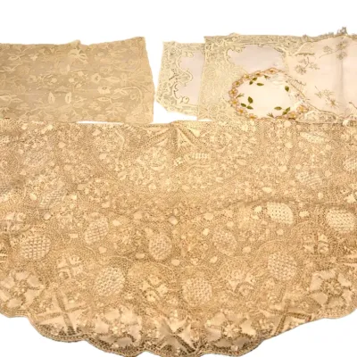 Sale Photo Thumbnail #211: Collection of vintage white and off-white lace linens, including placemats, doilies, and a floral embroidered handkerchief.