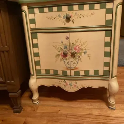 Sale Photo Thumbnail #3: Hand-painted French country style nightstand with sage green trim, floral motifs, a single upper drawer, and lower cabinet doors.