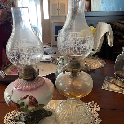 Sale Photo Thumbnail #42: Pair of antique oil lamps with etched glass chimneys, including one hand-painted floral glass base and one clear ribbed glass base.