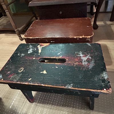 Sale Photo Thumbnail #110: Rustic distressed wooden step stools, featuring a dark green painted stool with carrying slot in the foreground.