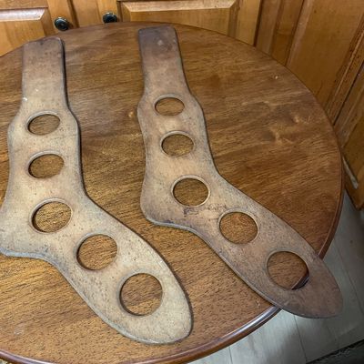 Sale Photo Thumbnail #12: Pair of vintage wooden sock stretchers with circular cutouts for airflow.