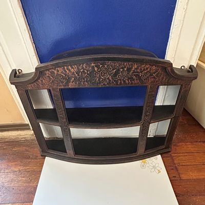 Sale Photo Thumbnail #84: Vintage wall-mounted curio display shelf featuring tiger oak finish with carved floral detailing and small tiered display ledges.