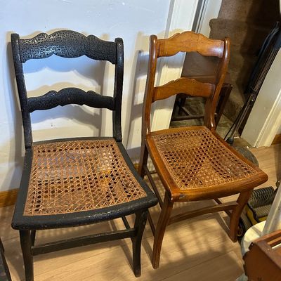 Sale Photo Thumbnail #105: Pair of antique ladder-back side chairs with woven cane seats, including one black-painted and one natural wood finish.