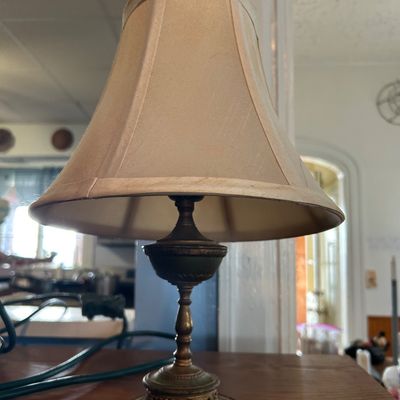 Sale Photo Thumbnail #27: Small vintage brass accent lamp with an ornate filigree base and a light beige fabric shade.
