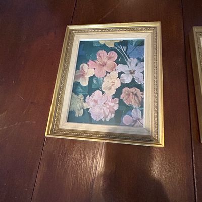Sale Photo Thumbnail #80: Framed floral art print featuring pink, white, and yellow blossoms, housed in an ornate gilded frame with a light wood liner.