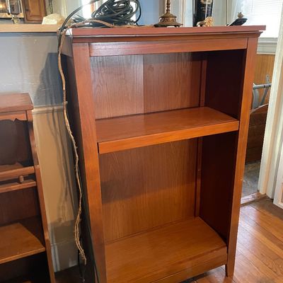 Sale Photo Thumbnail #4: Mid-century modern style warm wood bookshelf featuring a clean-lined rectangular frame and two open shelves.