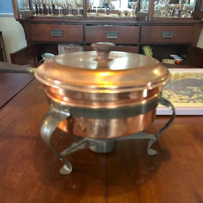 Sale Photo Thumbnail #64: Vintage copper chafer fondue pot set complete with lid and metal burner stand.