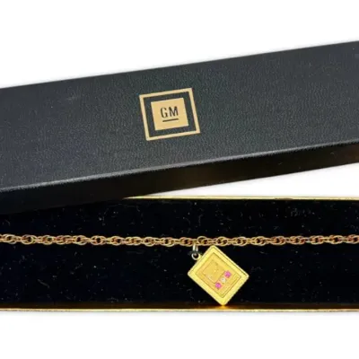 Gold filled diamond ruby general motors pendant bracelet