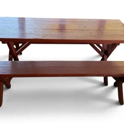 Red painted wooden picnic table benches