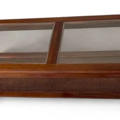 Wooden two tier glass top coffee table with woven shelf