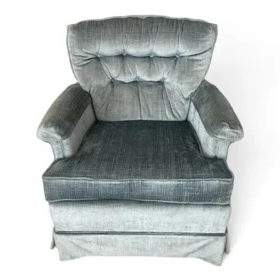 Mid century blue velour cushioned armchair