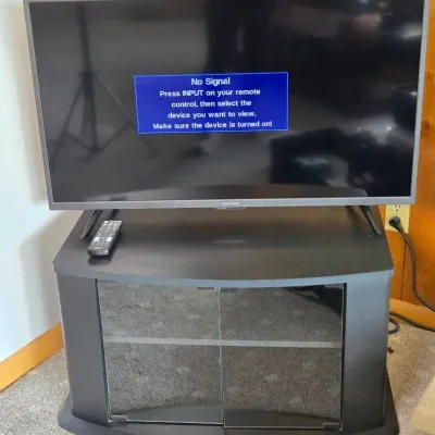 41" Insignia Flat Screen TV with Remote & Black Glass-Door Media Stand
