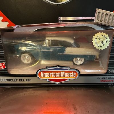 Sale Photo Thumbnail #165: Ertl American Muscle Collector's Edition 1:18 scale die-cast model of a 1955 Chevrolet Bel Air, sealed in original box with a limited edition sticker.