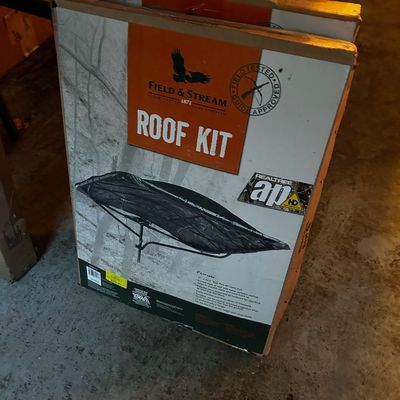 Sale Photo Thumbnail #11: Field & Stream tree stand roof kit in its original retail box featuring Realtree AP camo styling.