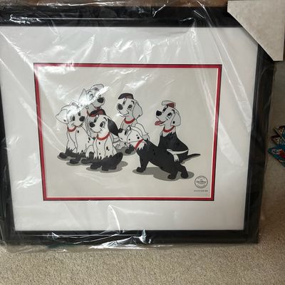 Sale Photo Thumbnail #141: Framed Disney animation sericel featuring puppies from 101 Dalmatians covered in soot, preserved in protective plastic wrap.