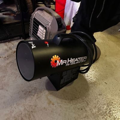 Sale Photo Thumbnail #36: Mr. Heater 75-125,000 BTU forced-air propane space heater in black finish.