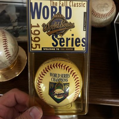 Sale Photo Thumbnail #60: 1995 World Series Champions Atlanta Braves commemorative baseball by Fotoball, sealed in its original plastic clamshell packaging.