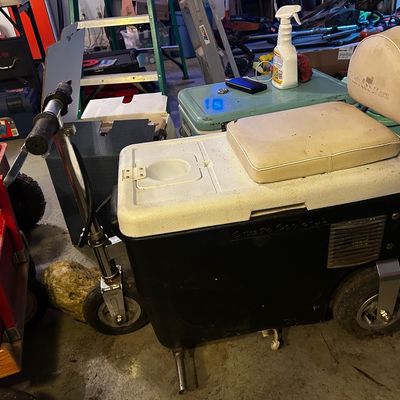 Sale Photo Thumbnail #10: Cruzin Cooler motorized cooler scooter with off-white vinyl seat and backrest, showing light wear.