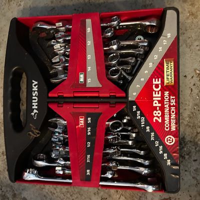 Sale Photo Thumbnail #152: Husky 28-piece combination wrench set in a red and black plastic carrying case, featuring both metric and SAE sizes.