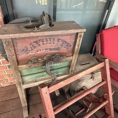 Sale Photo Thumbnail #228: Antique wooden hand-crank fanning mill featuring original stenciling and cast iron hardware.