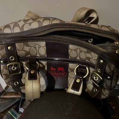 Sale Photo Thumbnail #133: Coach Signature canvas shoulder bag with dark brown leather trim, brass hardware, and red horse and carriage logo detail.