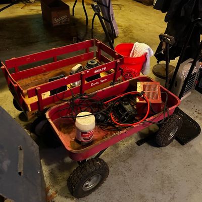 Sale Photo Thumbnail #77: Vintage Sears Country Squire wooden slat wagon and a red metal utility wagon holding various tools and electrical supplies.