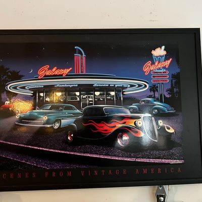 Sale Photo Thumbnail #90: Framed "Scenes From Vintage America" art print depicting hot rods parked in front of a retro neon diner at night.