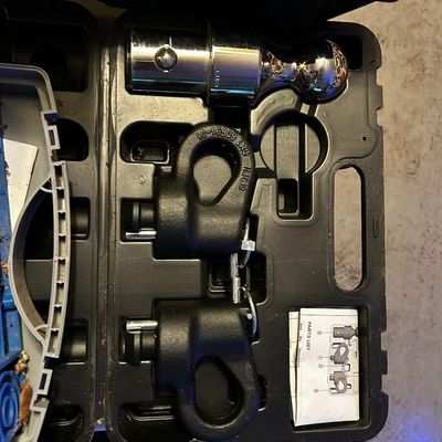 Sale Photo Thumbnail #30: Curt gooseneck hitch ball and safety chain anchor set stored inside a black molded plastic case with documentation.