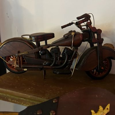 Sale Photo Thumbnail #86: Handcrafted wooden motorcycle model with wire and brass metal accents, designed in the style of a vintage Indian Scout or Chief.