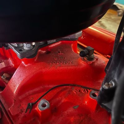Sale Photo Thumbnail #48: Vintage General Motors orange intake manifold with stamped casting number 3919803.