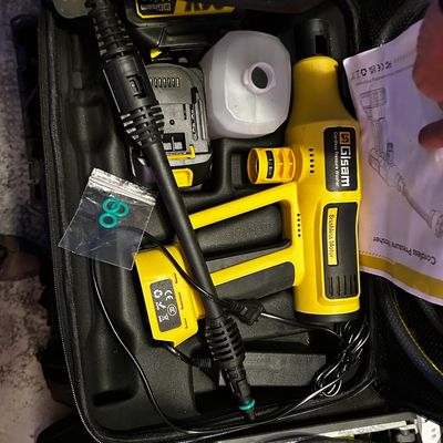 Sale Photo Thumbnail #33: Gisam cordless pressure washer kit in a fitted hard case with batteries, spray lance, detergent bottle, and manual.